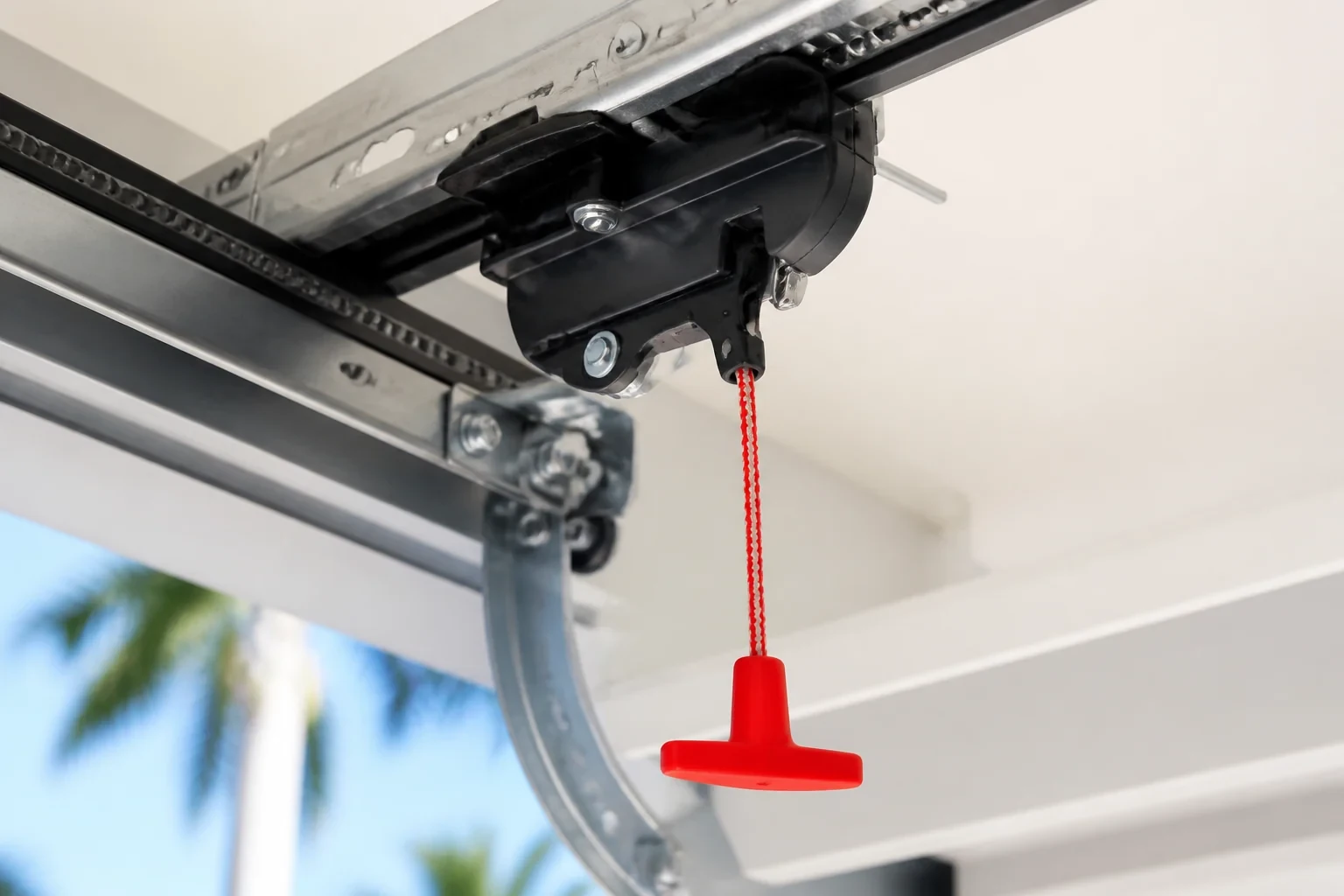 Red release cord and handle attached to an opener trolley